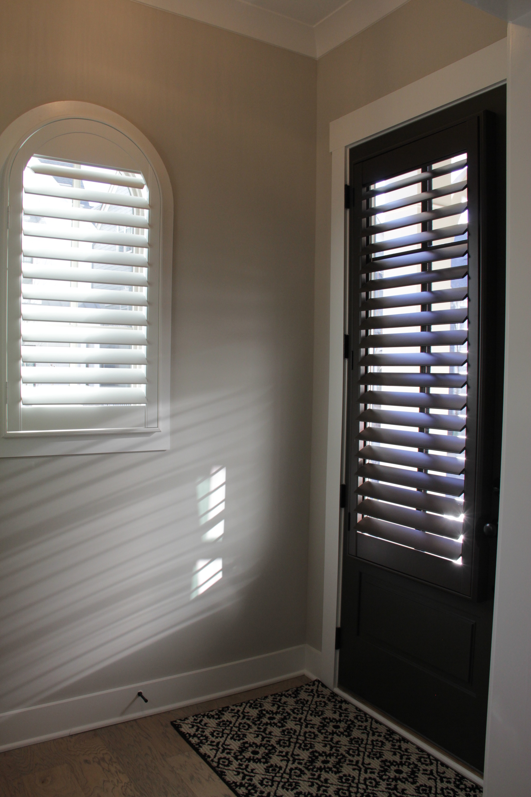 Arch Window Plantation Shutter and Dark Stain Door Shutter